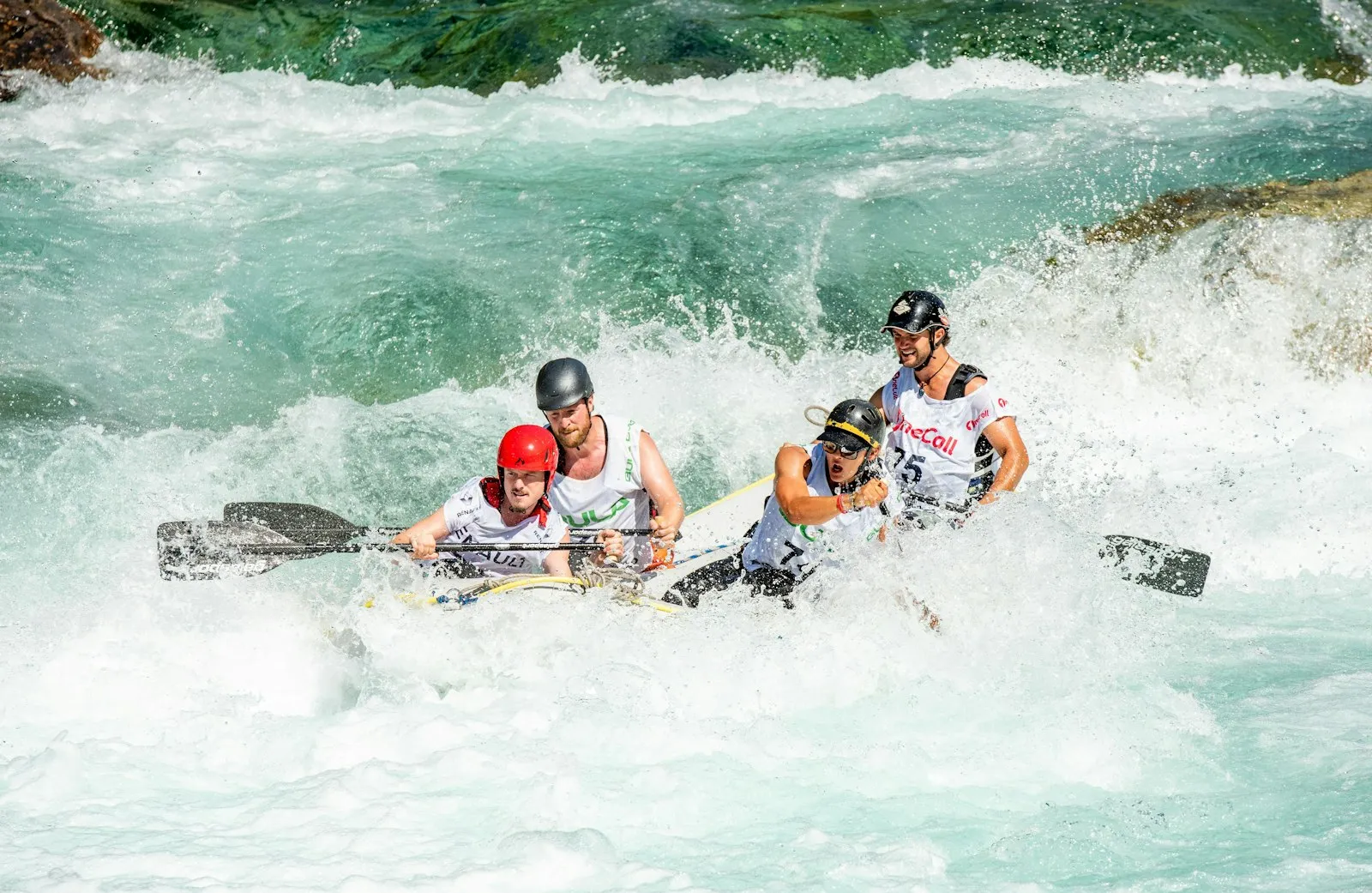 Rafters paddling through whitewater on the Ganga